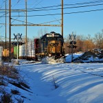 Freight trains dashing through snow to make up time lost